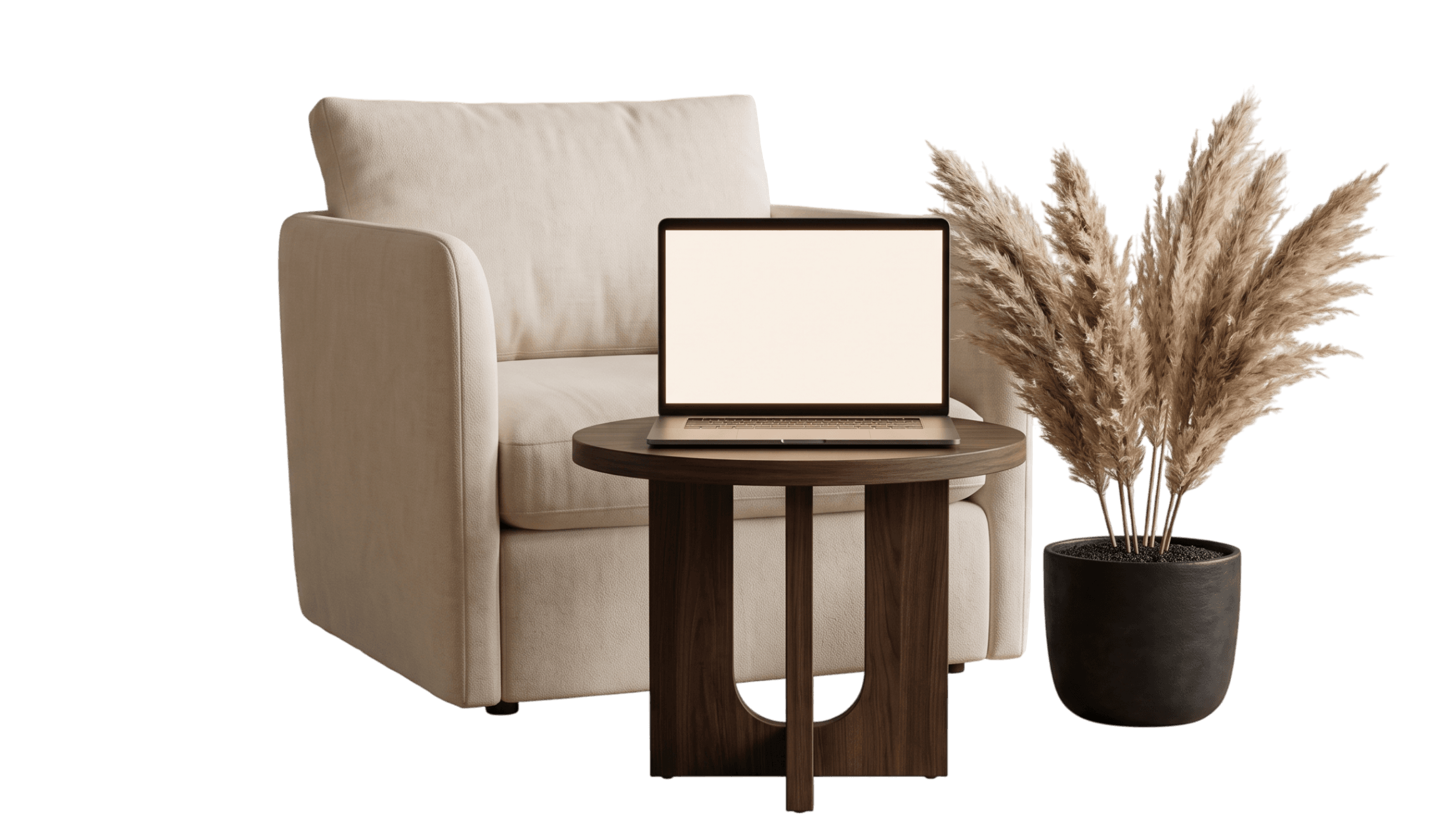 Open laptop with a blank screen on a round dark wood side table, beside a cream armchair and a black pot of pampas grass